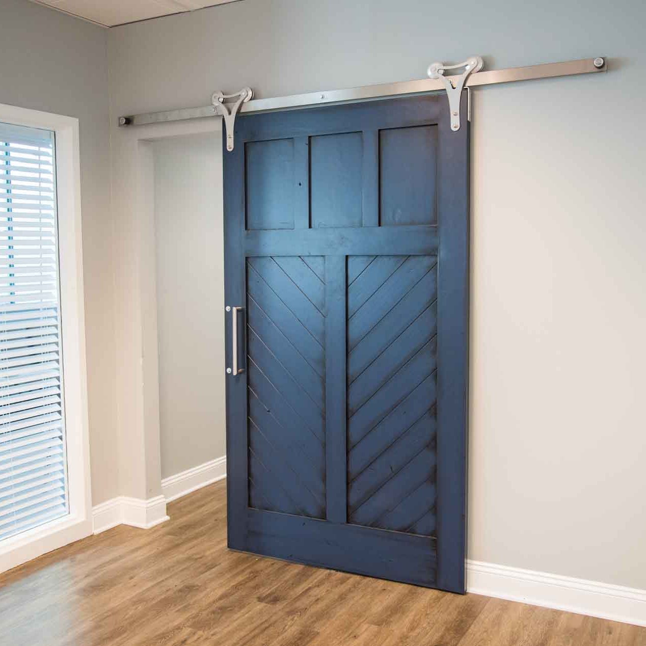 blue sliding barn door inside home